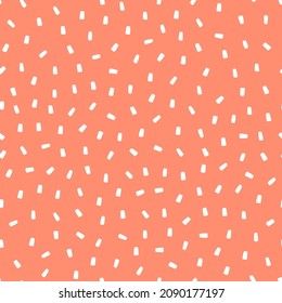 Saupoudrage blanc sur fond rose, motif harmonieux.