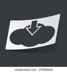 White sticker with black image of cloud and down arrow, on black background