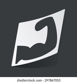 White sticker with black image of muscular arm, on black background