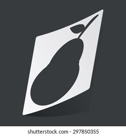 White sticker with black image of pear fruit, on black background