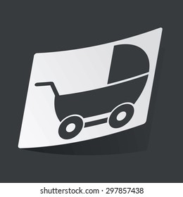 White sticker with black image of perambulator, on black background