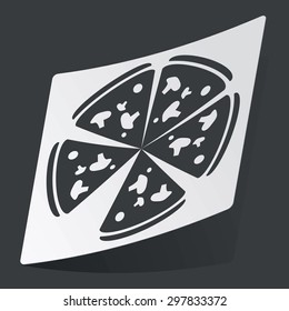 White sticker with black image of pizza, on black background