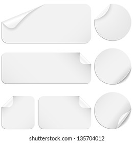 White Stickers - Set of white paper stickers isolated on white background.