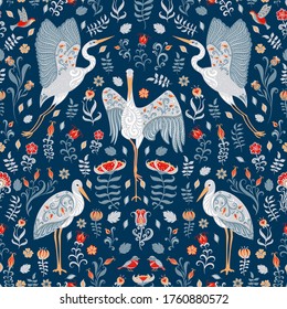 White storks with ornaments on a blue floral background. Folk Art. 