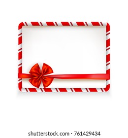 White stripe Christmas frame tied with a red shiny ribbon bow. Design element for Christmas, birthday, anniversary, new year, party or other celebrations and events. Place for text.