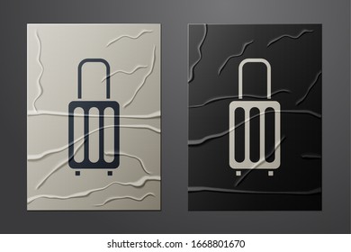 White Suitcase for travel icon isolated on crumpled paper background. Traveling baggage sign. Travel luggage icon. Paper art style. Vector Illustration