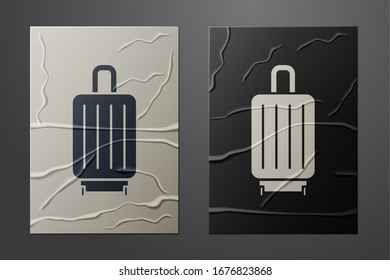 White Suitcase for travel icon isolated on crumpled paper background. Traveling baggage sign. Travel luggage icon. Paper art style. Vector Illustration