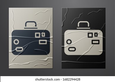 White Suitcase for travel icon isolated on crumpled paper background. Traveling baggage sign. Travel luggage icon. Paper art style. Vector Illustration