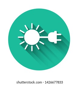 White Sun with electric plug icon isolated with long shadow. Energy saving concept. Green circle button. Vector Illustration