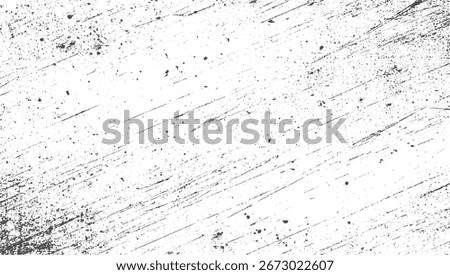 white surface covered in black speckles and diagonal scratch marks creating a distressed texture.
