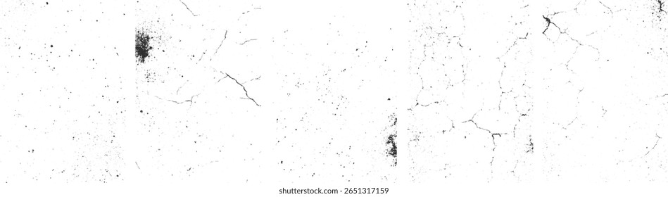 Superfície branca com manchas pretas dispersas e fendas finas, criando uma textura angustiada.