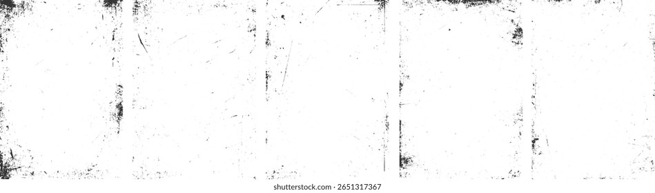 Uma superfície branca com manchas pretas dispersas e riscos lineares criando um efeito grunge angustiado.