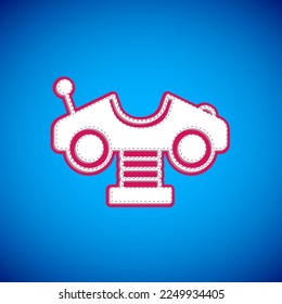 White Swing car on the playground icon isolated on blue background. Childrens carousel with car. Amusement icon.  Vector