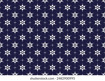 White symbol floral on dark blue background, ethnic fabric seamless pattern design for cloth, carpet, batik, wallpaper, wrapping etc.