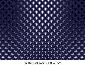 White symbol flowers form on dark blue background, ethnic fabric seamless pattern design for cloth, carpet, batik, wallpaper, wrapping etc.