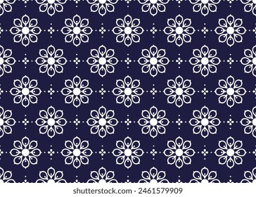 White symbol flowers on dark blue background, ethnic fabric seamless pattern design for cloth, carpet, batik, wallpaper, wrapping etc.