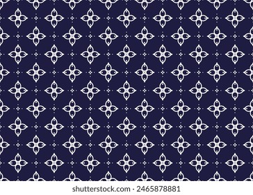 White symbol flowers on dark blue background, ethnic fabric seamless pattern design for cloth, carpet, batik, wallpaper, wrapping etc.