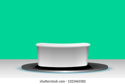 white table with green background in the news studio room