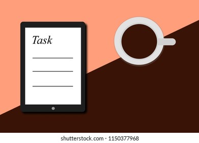 A white tablet to record the tasks next to the cafe