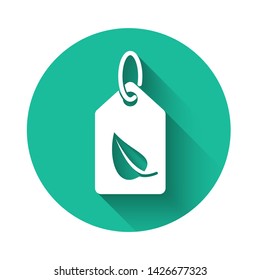 White Tag with leaf symbol icon isolated with long shadow. Banner, label, tag, logo, sticker for eco green. Green circle button. Vector Illustration