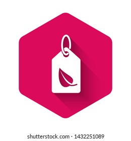 White Tag with leaf symbol icon isolated with long shadow. Banner, label, tag, logo, sticker for eco green. Pink hexagon button. Vector Illustration