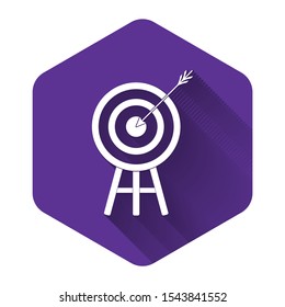 White Target with arrow icon isolated with long shadow. Dart board sign. Archery board icon. Dartboard sign. Business goal concept. Purple hexagon button. Vector Illustration