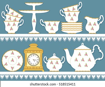 White tea set with roses motif and clock on lace  tablecloth