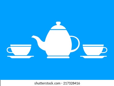 White teapot and teacup on blue background