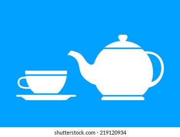 White teapot and teacup on blue background