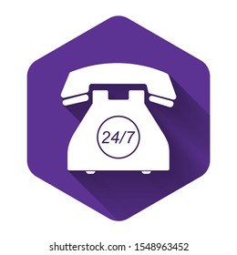 White Telephone 24 hours support icon isolated with long shadow. All-day customer support call-center. Open 24 hours a day and 7 days a week. Purple hexagon button. Vector Illustration
