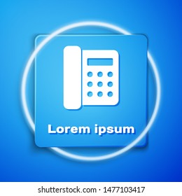 White Telephone icon isolated on blue background. Landline phone. Blue square button. Vector Illustration