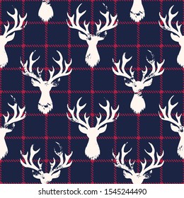 White Textured Silhouettes of a Deer Head on a Classic Blue and Red Checkered Plaid Background Vector Seamless Pattern. Winter Holidays Pattern Print Perfect for Gift Wrap, Textiles, Cards