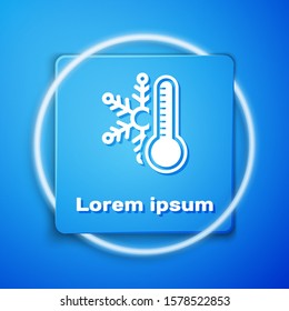 White Thermometer with snowflake icon isolated on blue background. Blue square button. Vector Illustration
