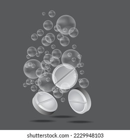 Tres pastillas blancas con las burbujas de agua aisladas en el fondo gris.