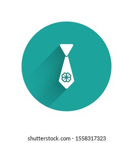 White Tie with four leaf clover icon isolated with long shadow. Necktie and neckcloth symbol. Happy Saint Patricks day. Green circle button. Vector Illustration