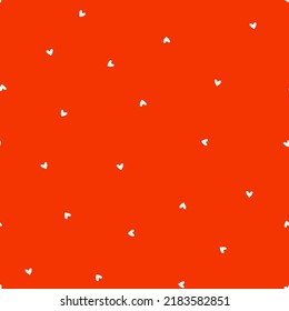 White tiny hearts seamless pattern with orange background.