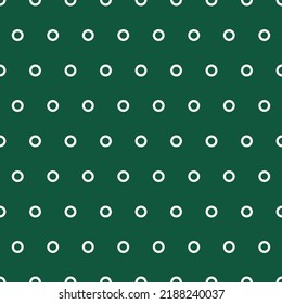 White tiny rings seamless pattern with green background.