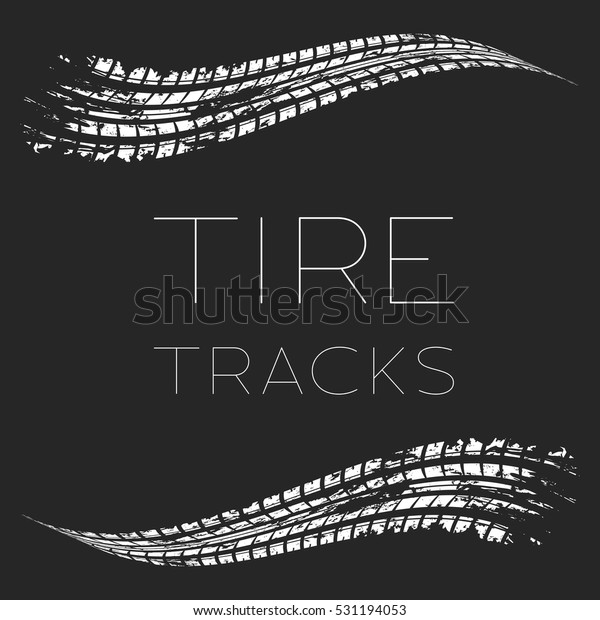 White tire tracks with thin sample text
isolated on dark
background