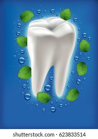 white tooth with fresh mint leaf and water drops