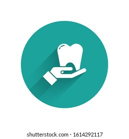 White Tooth icon isolated with long shadow. Tooth symbol for dentistry clinic or dentist medical center and toothpaste package. Green circle button. Vector Illustration