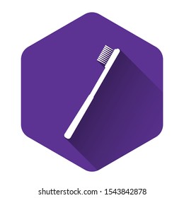 White Toothbrush icon isolated with long shadow. Purple hexagon button. Vector Illustration