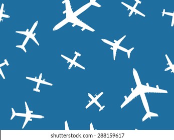 White top view airpane on blue background seamless pattern. Transport icon collection. Vector seamless pattern with jet and propeller airplane.