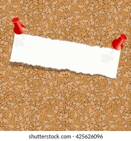 White torn piece of paper attached pushpin on a cork board. Blank page attached to a cork notice board.