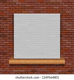 White translucent frame on a wooden shelf on the background of an old brick wall.