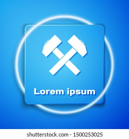 White Two crossed hammers icon isolated on blue background. Tool for repair. Blue square button. Vector Illustration