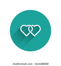 White Two Linked Hearts icon isolated with long shadow. Romantic symbol linked, join, passion and wedding. Valentine day. Green circle button. Vector Illustration