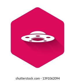 White UFO flying spaceship icon isolated with long shadow. Flying saucer. Alien space ship. Futuristic unknown flying object. Pink hexagon button. Vector Illustration
