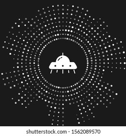 White UFO flying spaceship icon isolated on grey background. Flying saucer. Alien space ship. Futuristic unknown flying object. Abstract circle random dots. Vector Illustration