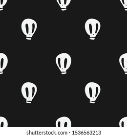White ugly skulls seamless pattern on black background