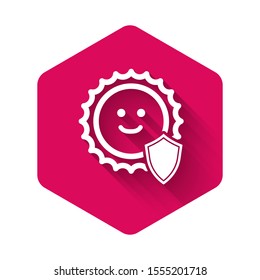 White UV protection icon isolated with long shadow. Sun and shield. Ultra violet rays radiation. SPF sun sign. Pink hexagon button. Vector Illustration